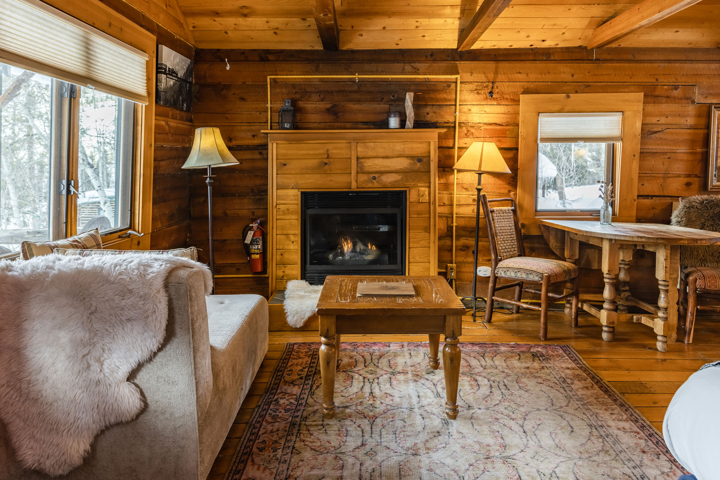 Cozy restored cabin interior with fireplace